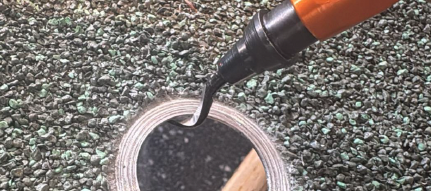 Deburring the edge of the 28mm hole in a Metrotile sheet