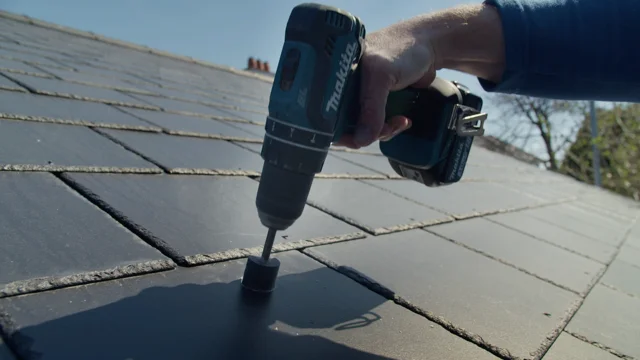 Pre-drilling the rafter using the SolVe Mount drill guide through Cambrian slate